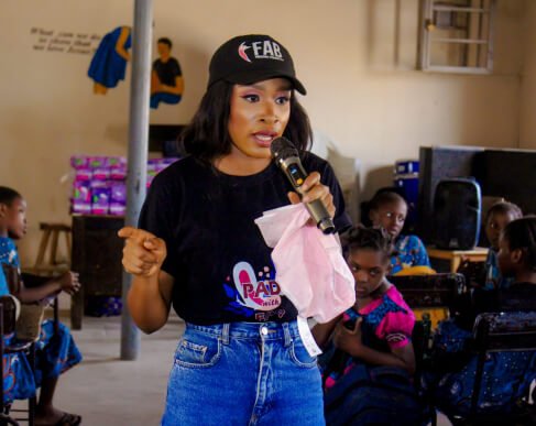 Festus Abigail lecturing female students